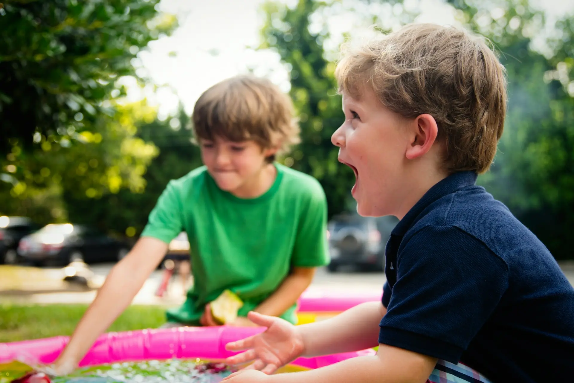 two boys laughing and playing